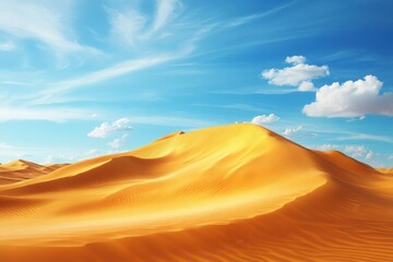 Fototapeta premium Expansive golden sand dunes under a bright blue sky with scattered clouds