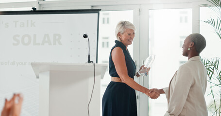 Business, women and handshake for award, success and congratulations for achievement, ceremony and team. Shaking hands, colleagues and gesture for appreciation to employee, prize and accomplishment