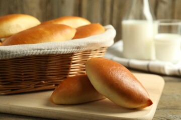 Tasty baked patties on wooden table, closeup