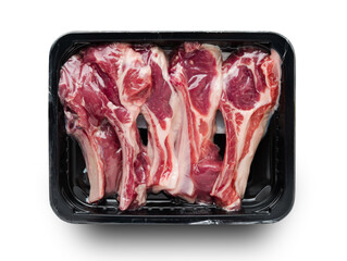 Racks of lamb in vacuum black package, top view on white background © Alex