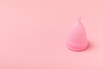 Menstrual cup on a bright background. Sanitary napkins, tampons and menstrual cup.Concept of...