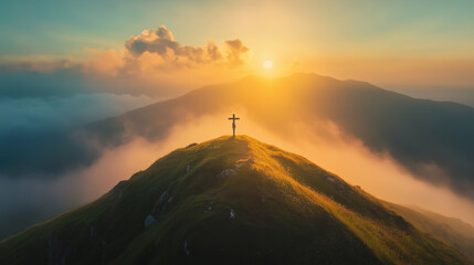 Christian cross standing on a hill during sunrise. Ascension of Jesus concept. Beautiful nature during sunrise or sunset. Cross on top of a hill, Christianity theme.