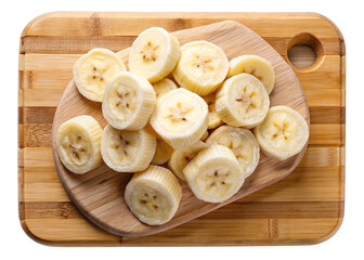Fototapeta premium Sliced bananas on a wooden cutting board, healthy eating and fresh fruit