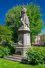 Obraz premium Saluzzo, Italy: Statue of Giambattista Bodoni inventor of the neoclassical Bodoni font, Statue in the gardens of Piazza Dante