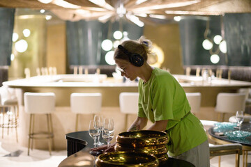 The production designer prepares the scenery on the set. The artist's work in building a frame for filming a movie, advertising, TV series. Modern photography technique.