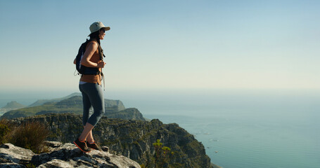 Hiking, space and thinking with woman on cliff for travel adventure, nature and trip. Fitness, reflection and vacation with person outdoor view on mountain for trekking holiday, explore and peace