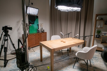 A podcast studio room with professional cameras, microphones and lighting fixtures. Audio and video...
