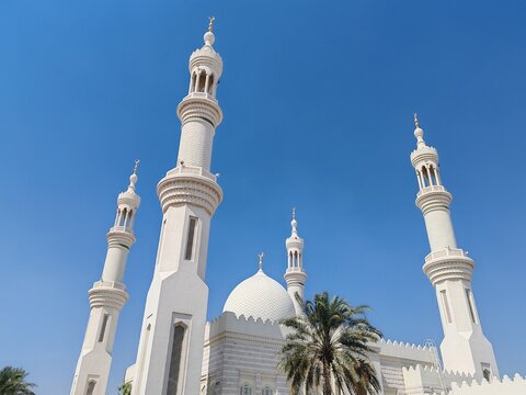 Beautiful Landscape mosque, Islamic background Mosque, Minaret of Mosque, Masjid design in Islamic religious architectural traditions. Sheikh Zayed Grand Mosque: AJMAN, UNITED ARAB EMIRATES.