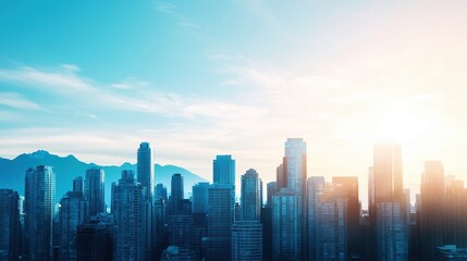 Fototapeta premium City skyline at sunrise with mountains in the background, showcasing urban structures and nature