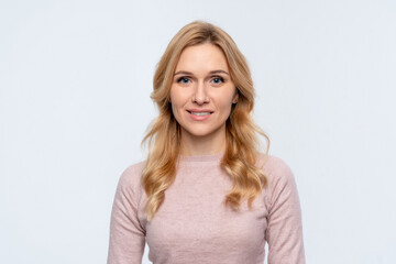 Fototapeta premium Photo of cheerful middle age blonde woman manager employee in casual clothes happy positive smile dream look at camera empty space isolated over white color background. People emotion concept