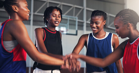 Happy women, meeting and basketball team with hands together for game, match or competition on...