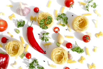 On a white background lies macaroni nests and vegetables.Texture.	