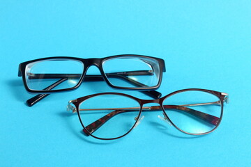 On a blue background there are two glasses, male and female.