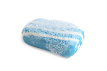 Raw soap in foam lies on a white background.