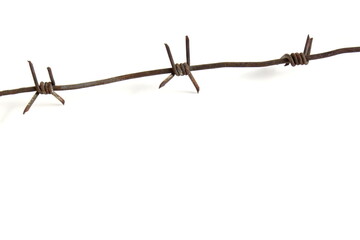 Barbed wire lies on a white background.	