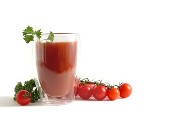  One glass with freshly squeezed tomato juice stands on a white background.	