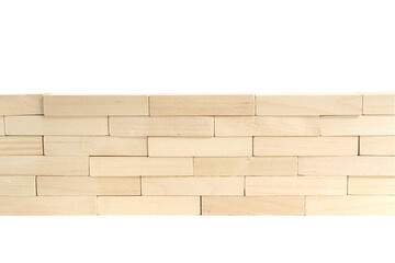 On a white background there are wooden blocks stacked into a wall.
