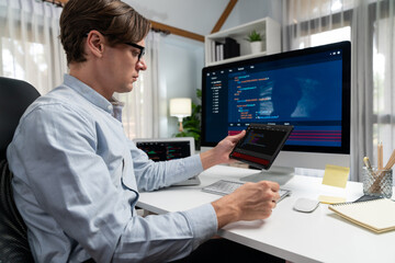Fototapeta premium IT developer selecting by point on coding online software development information on tablet comparing with pc and laptop screen with new code program on update version overall system. Pecuniary.