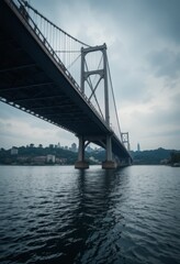 A modern suspension bridge spanning a wide river under a clear sky with sleek architectural lines Generative AI