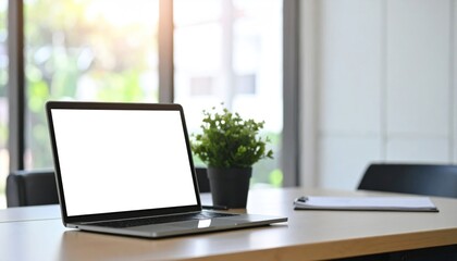 Fototapeta premium Open laptop with blank screen on modern office desk, workspace mockup minimal composition
