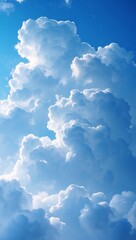Fluffy white clouds against a bright blue sky, conveying a sense of peace and openness. The clouds appear soft and billowing, creating a sense of depth and vastness