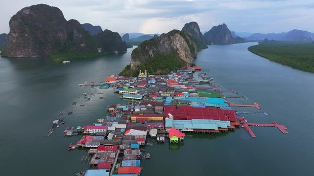 Koh Panyi, Phang Nga Bay floating village, captured from the sky, Thailand. Aerial drone video