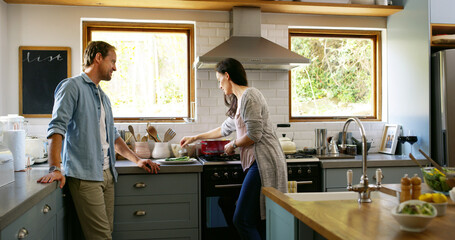 Couple, cooking and food in kitchen at house with organic ingredients, meal preparation and healthy...