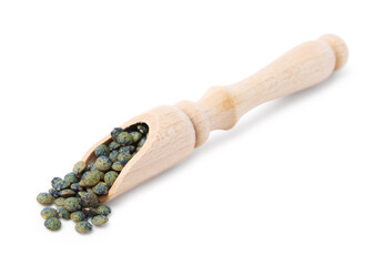 Raw lentils in wooden scoop isolated on white