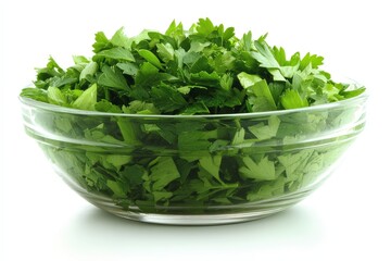 Freshly chopped parsley in a clear bowl ready for culinary use or garnishing dishes in a bright kitchen setting
