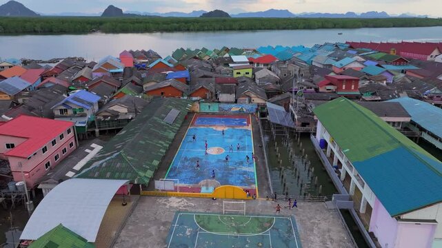 Floating soccer field on Koh Panyi island, captured from the sky, Thailand. Aerial drone video