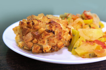 Chopped cutlet with boiled vegetables, close-up
