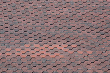 The hexagonal tiles create a visually appealing pattern on the rooftop. This design highlights a blend of functionality and aesthetic appeal in urban architecture