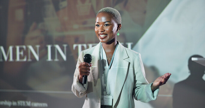 Business, speech and black woman at seminar for motivation at tech conference with mic. Convention, presentation and keynote speaker at event for story, advice and inspiration with happy programmer