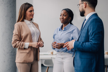 Business people talking and discussing work in office