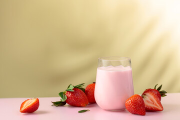 Strawberry yogurt and fresh berries on a colorful background.