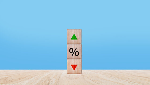 Financial, stocks, interest rate and GDP percent change, wooden block with percentage sign and arrow up sign and down for interest rate, ranking