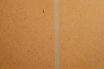 Fototapeta premium Brown recycled paper texture with vertical fold 