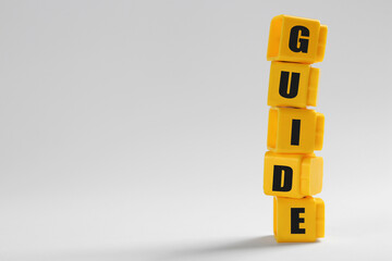 Word Guide made of blocks with letters on white background, space for text
