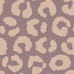 Seamless leopard fur pattern. Fashionable wild leopard print background. Modern panther animal fabric textile print design. Stylish vector mocha mousse color illustration