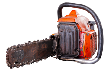 An old, neglected and rusty petrol saw for cutting wood and forest clearing.	
