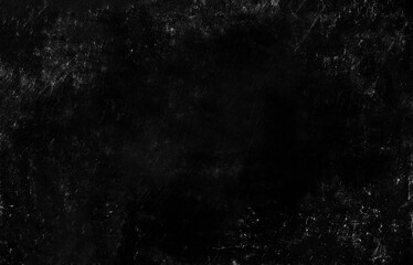 A dark, scratched black texture with a distressed, grungy look perfect for backgrounds or edgy design work.