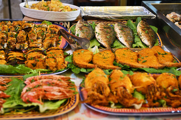 Stall with fried seafood and vegetables