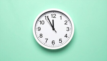 Minimalist White Wall Clock on a Soft Green Background – A Simple and Timeless Design for Interior Spaces