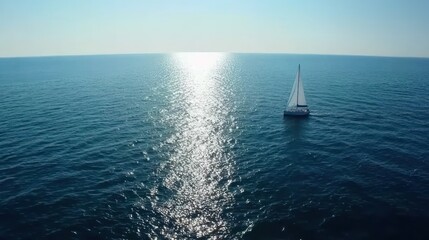 Fototapeta premium Solitary Sailboat on Serene Ocean