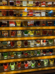 Colorful alcohol shots drinks in nightclub in summer. High quality photo