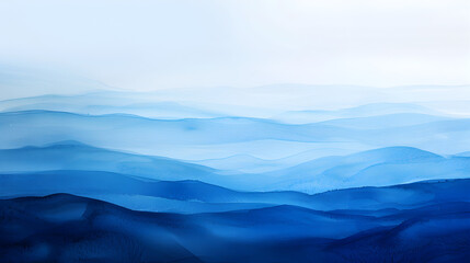 Obraz premium A scenic view of layered mountain ranges in shades of blue with a hazy atmospheric perspective