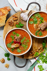 Traditional Georgian soup kharcho with walnuts.top veiw