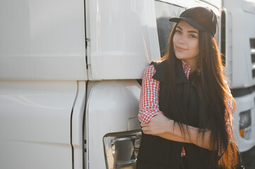 Portrait of beautiful young woman professional truck driver