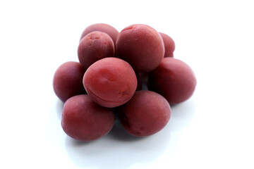 Umeboshi, Japanese pickled plums, Sour and salty taste.
