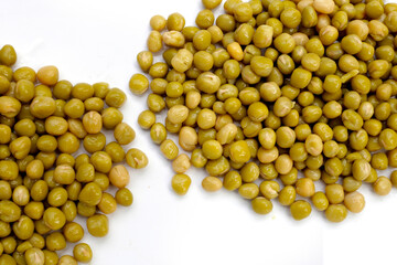 Canned green peas on white background.